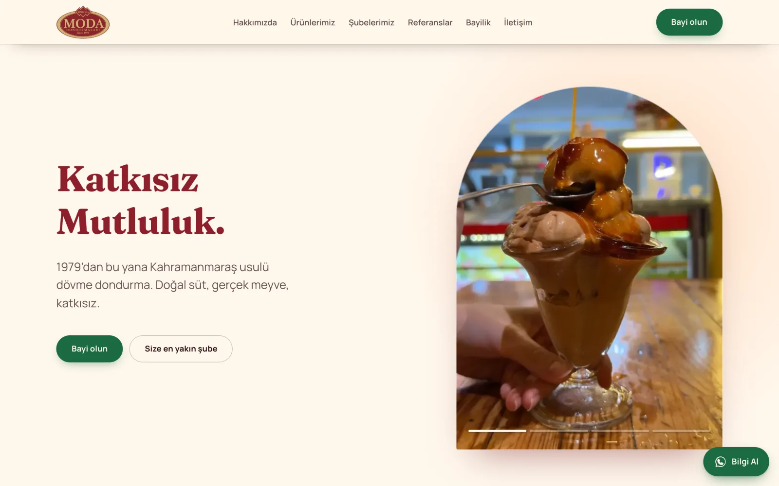 The Binboğa Moda home page: a serif headline on warm cream, with a looping clip of a sundae being served cropped into an arch beside it.